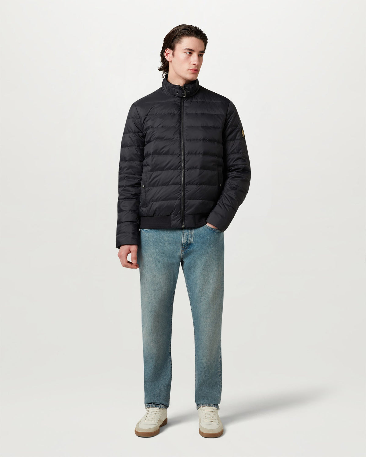 Model wearing the Circuit jacket in Dark Ink zipped up with a tall collar
