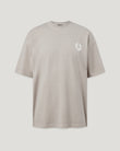 Front view of the concrete colored Competition T-shirt showcasing a small white logo on the chest