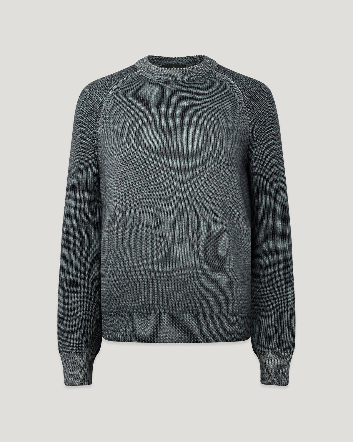 Male model wearing gray garment dye crew neck sweater with textured sleeves