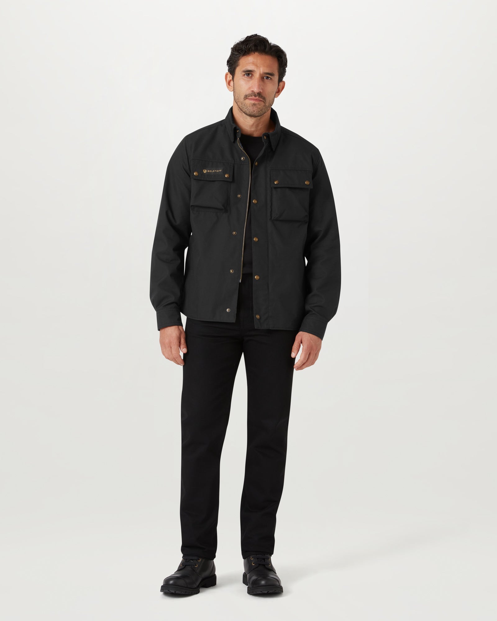 Front view of a man wearing the Belstaff Mansion Motorcycle Shirt in black with zip front and snap chest pockets