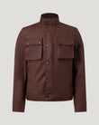 Racemaster Icon jacket in oxblood waxed cotton with a tall buckle collar and brass buttoned chest pockets.