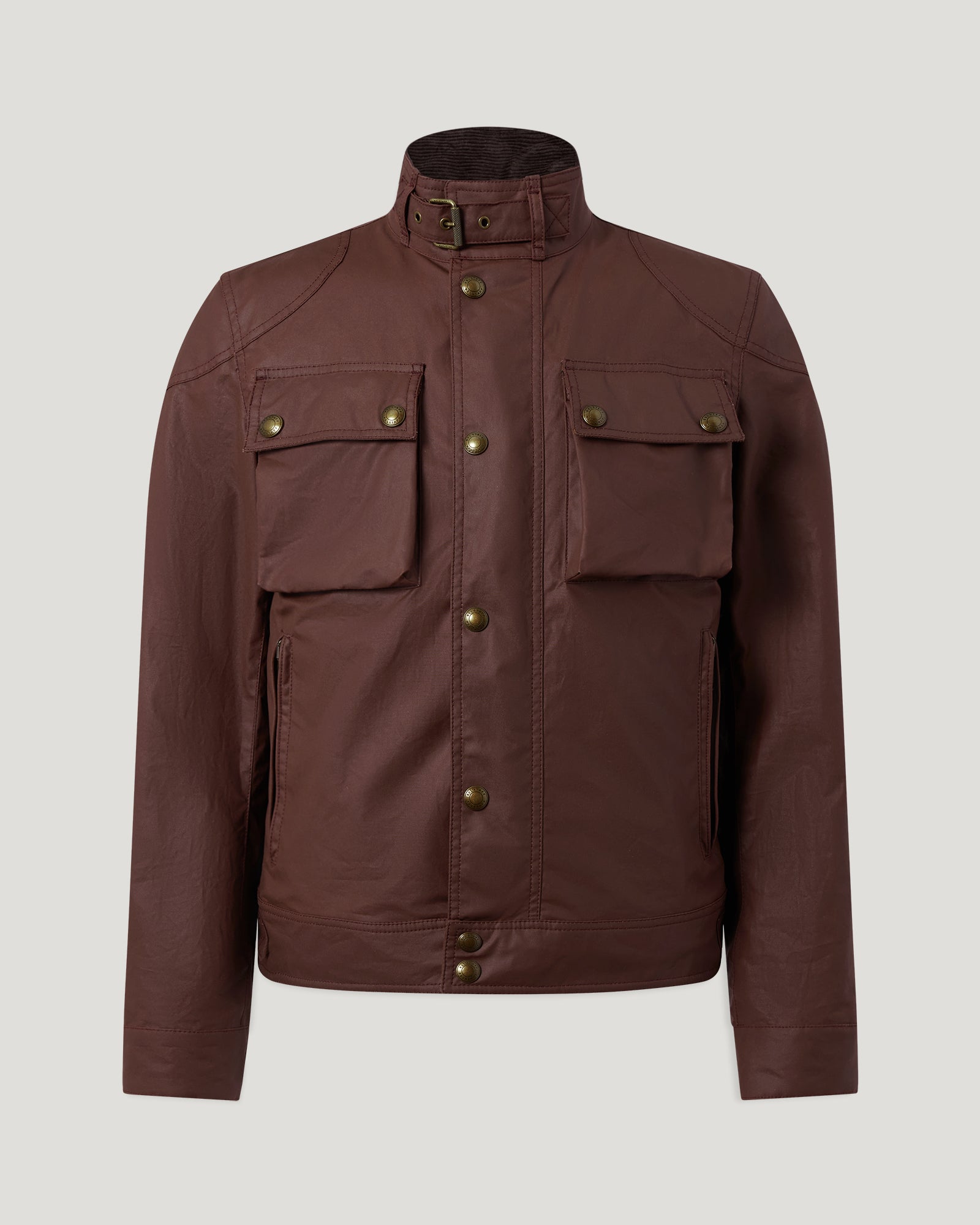 Racemaster Icon jacket in oxblood waxed cotton with a tall buckle collar and brass buttoned chest pockets.