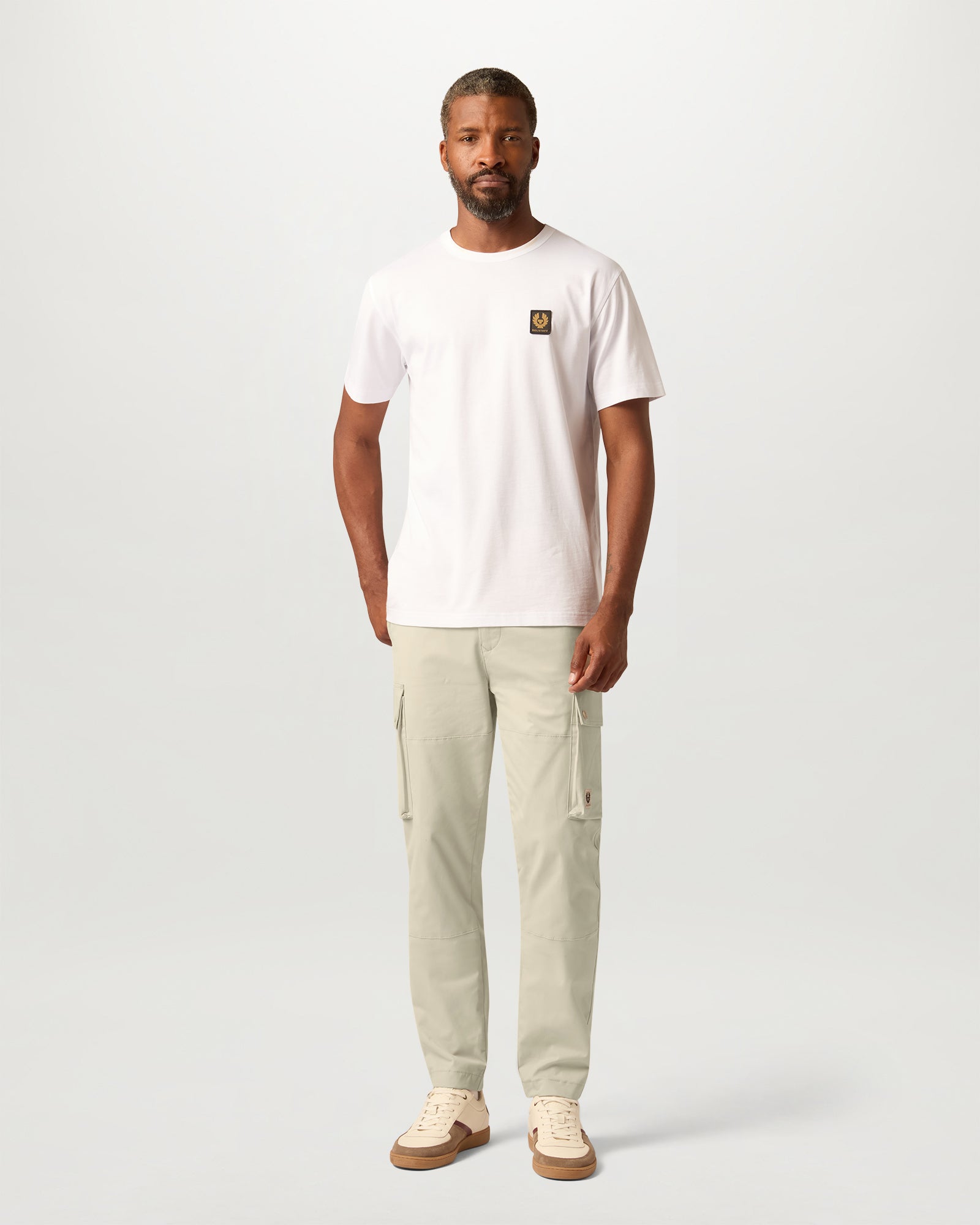 Full length Pale Stone Route Cargo trousers with cargo pockets and cuffs worn by a model.