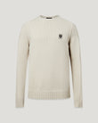 Watch Crew Neck Jumper in pale stone worn by a model with Phoenix patch on the left chest