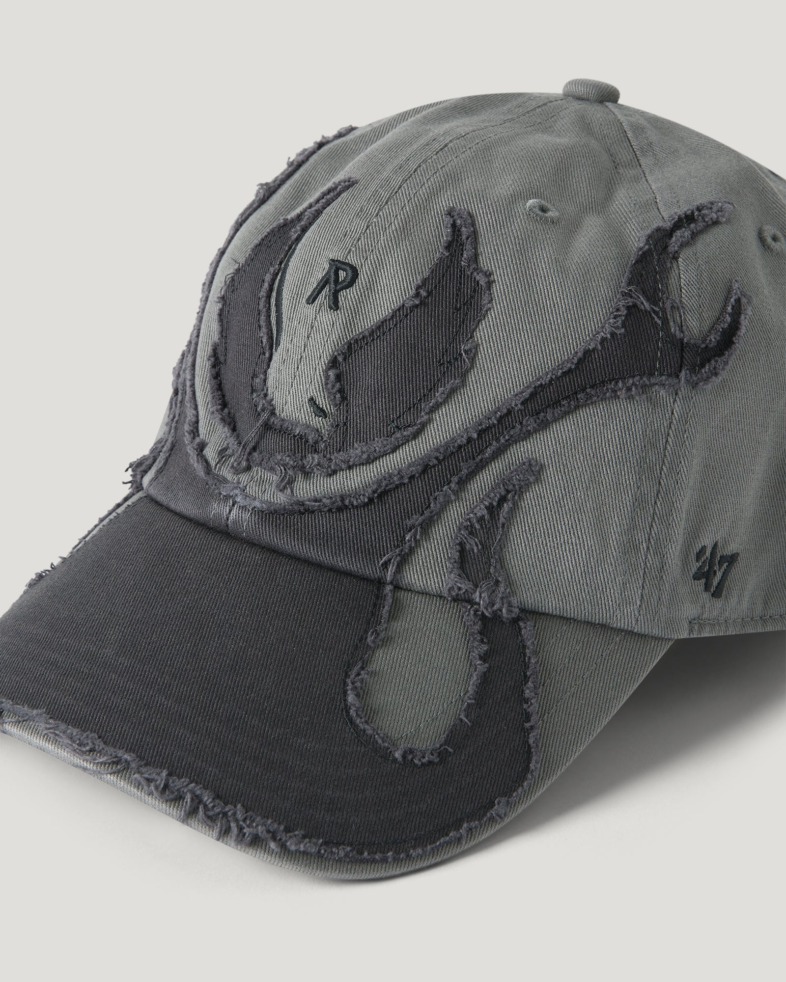 Top view of the BELSTAFF X REPRESENT WINGS cap in grey denim with distressed wing embroidery